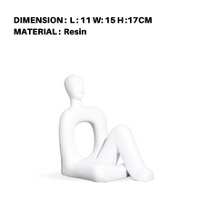 Red and White Sitting Human Decor