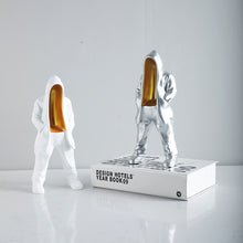 Silver mysterious figurine