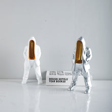 Silver mysterious figurine